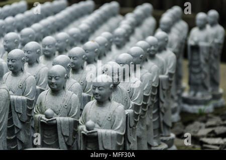 Japanese budhist monk statues praying and meditating Stock Photo