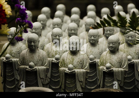 Japanese budhist monk statues praying and meditating Stock Photo