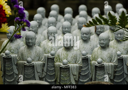 Japanese budhist monk statues praying and meditating Stock Photo