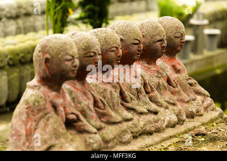 Japanese budhist monk statues praying and meditating Stock Photo