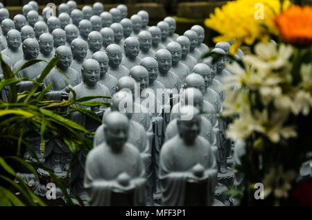 Japanese budhist monk statues praying and meditating Stock Photo