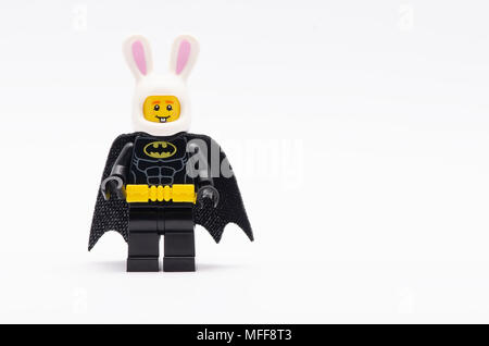 mini figure of batman wearing bunny helmet . Lego minifigures are manufactured by The Lego Group. Stock Photo