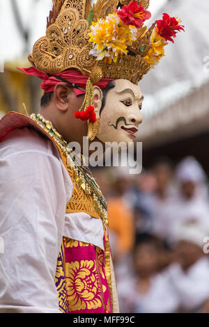 Bali, Indonesia - September 17, 2016: Unidentified balinese man performing in mask during Galungan celebration in Ubud, Bali Stock Photo