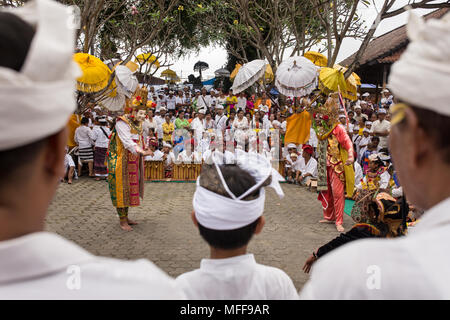 Bali, Indonesia - September 17, 2016: Unidentified balinese people performing in traditional masks during Galungan celebration in Ubud, Bali Stock Photo