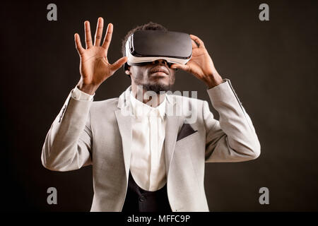 Afro unshaven businessman in 3D glasses for PC exploring virtual reality. generate realistic image. enjoy VR. Stock Photo