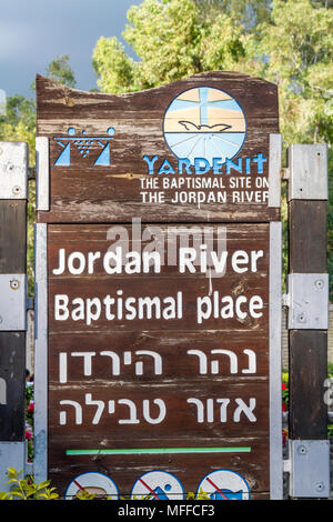 Wooden sign on shore of Jordan River at Baptismal Site, Israel Stock Photo