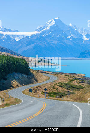 new zealand south island new zealand a winding road with no traffic in mount cook national park by the side of lake pukaki new zealand Stock Photo