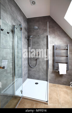 Clean modern interior of small bathroom with square shower cabin Stock Photo