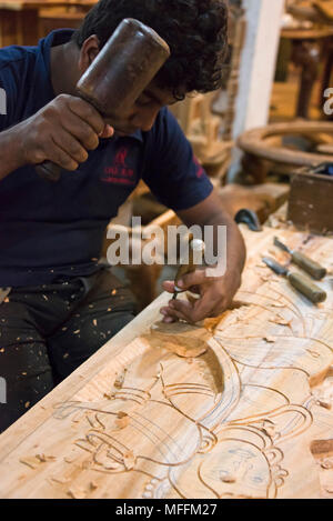 Vertical portrait of a woodcarver in Sri Lanka. Stock Photo