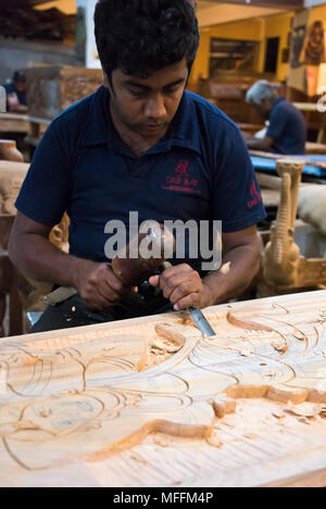 Vertical portrait of a woodcarver in Sri Lanka. Stock Photo