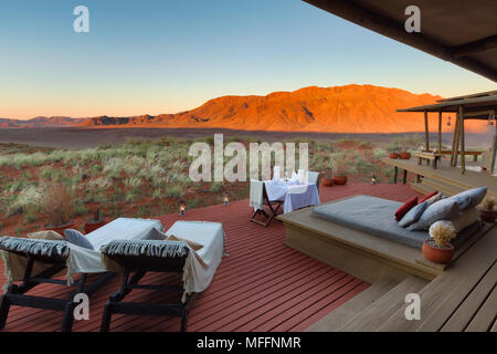 Romantic dining on deck area of mountain view suite. Dunes lodge. Wolwedans NamibRand Nature Reserve. Namibia    PROPERTY RELEASED Stock Photo