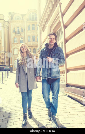Couple walking at the street and having fun Stock Photo