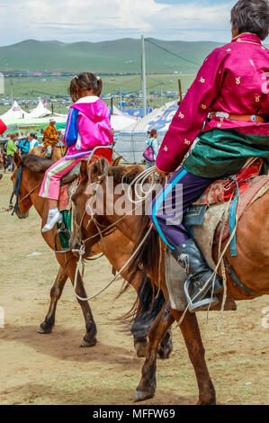 Khui Doloon Khudag, Mongolia - July 12, 2010: Horseback riders at Nadaam horse race on steppe outside the capital Ulaanbaatar