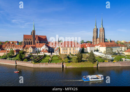 Poland. Wroclaw. Ostrow Tumski, Gothic cathedral of St. John the Baptist,  Collegiate Church of the Holy Cross, Archbishop's palace, tourist ship, boa Stock Photo