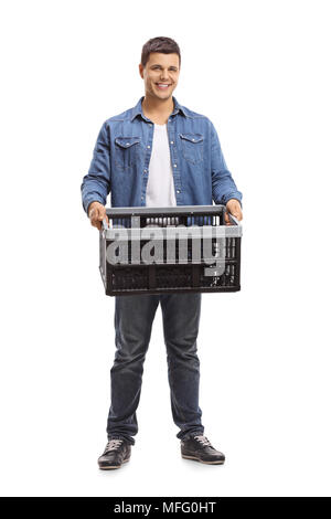 Full length portrait of a young man holding an empty plastic crate isolated on white background Stock Photo