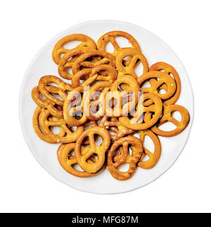 Salt pretzels on plate isolated white Top view Stock Photo