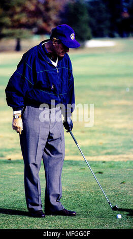 Camp Springs, Maryland, November 3,  1991 President George H.W. Bush gets ready to drive one down the fairway from the first tee at Andrews Air Force Base Stock Photo