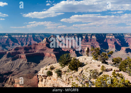 View of The Grand Canyon from Grandview point. The Rim projection with a vertical standing stone backdropped by the deep red wall of the north rim. Stock Photo