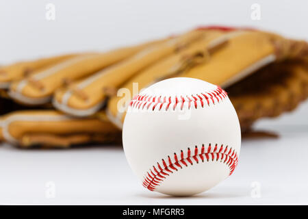 Professional leather baseball and glove isolated on white background. Stock Photo