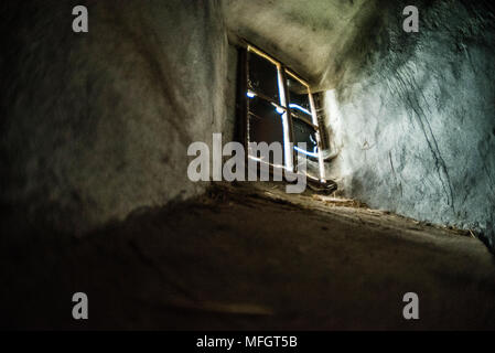 Mystical interior. Old window in dark castle dungeon. Ray of light Stock Photo