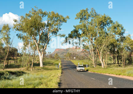Car driving along Larapinta Drive. State Highway 6 to the west of Alice Springs. Northern Territory, Australia. Stock Photo