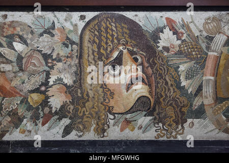 Theatrical tragic mask depicted in the Roman mosaic from the Casa del Fauno (House of the Faun) in Pompeii, now on display in the National Archaeological Museum (Museo Archeologico Nazionale di Napoli) in Naples, Campania, Italy. Stock Photo