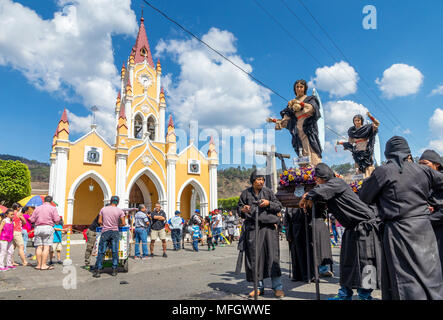 Participants of the Holy Saturday procession waiting in front of the San Felipe de Jesus Church near Antigua, Guatemala, Central America Stock Photo
