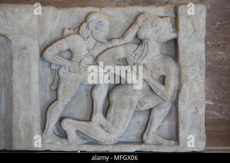Heracles kills Alcyoneus. Archaic sandstone metope from the Heraion (First Temple of Hera) at Foce del Sele dated from the middle of the 6th century BC on display in the Paestum Archaeological Museum (Museo archeologico di Paestum) in Paestum, Campania, Italy. Stock Photo