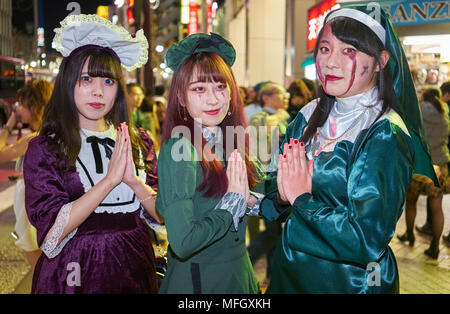 Young Japanese girls dressed as nuns at the Halloween celebrations in Shibuya, Tokyo, Japan, Asia Stock Photo