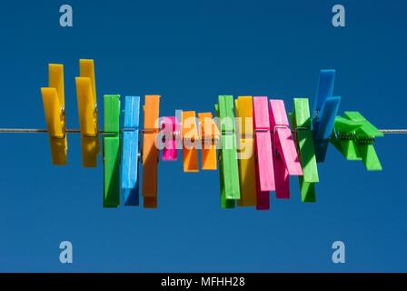 Multi coloured pegs Stock Photo