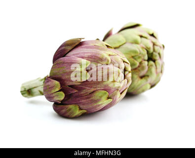 Two fresh artichokes with stem isolated on white background Stock Photo