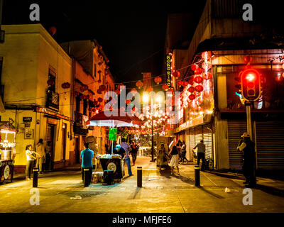 Late Night Food Vendors in the Barrio Chino in the Historic Center of Mexico City with Red Lanterns Overhead Stock Photo