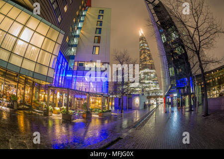 Fisheye view of More London skyline and The Shard visible in background at night, Southwark, London, England, United Kingdom, Europe Stock Photo