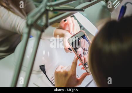 Mobile photography of manicure. Beautician concept Stock Photo