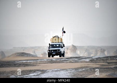 https://l450v.alamy.com/450v/mfk240/a-toyota-landcruiser-suv-crosses-the-way-desert-at-farafra-at-the-top-of-a-group-of-other-vehicles-taken-on-20042018-as-a-sign-for-the-egyptian-air-surveillance-he-leads-a-large-egyptian-flag-at-the-rear-of-the-vehicle-until-recently-the-white-desert-was-still-restricted-area-because-of-infiltration-and-smuggling-by-vehicles-from-the-after-libya-today-the-area-is-still-monitored-by-the-egyptian-air-security-photo-matthias-toedt-dpa-central-image-zb-picture-alliance-usage-worldwide-mfk240.jpg