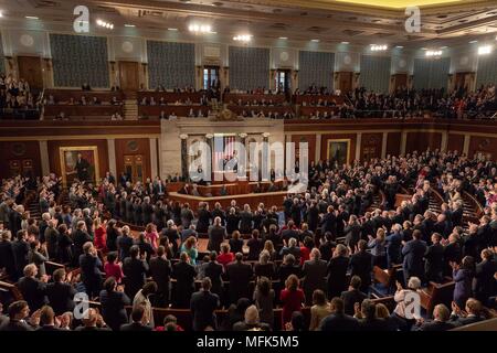 French President Emmanuel Macron receives a standing ovation during his address to a joint session of Congress as U.S Vice President Mike Pence and Speaker Paul Ryan look on April 25, 2018 in Washington, DC.  Macron is on a State Visit to Washington, the first since President Trump took office. Stock Photo