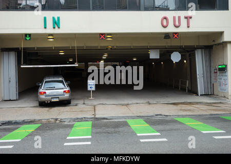 An automobile entering a parking garage Stock Photo