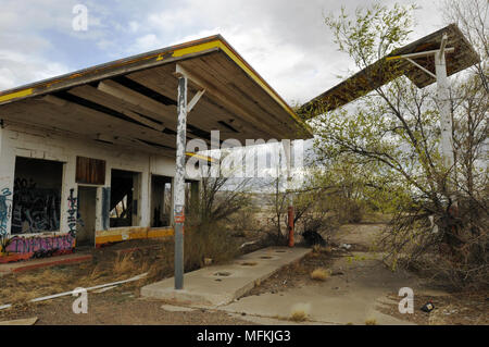 Ruins of a former Whiting Brothers gas station with a collapsing sign along old Route 66 west of San Fidel, New Mexico. Stock Photo
