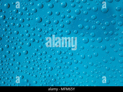 water drops on a glass surface blue Stock Photo