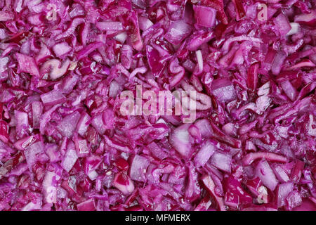 Finely chopped red cabbage vegetable background. Studio macro shot Stock Photo