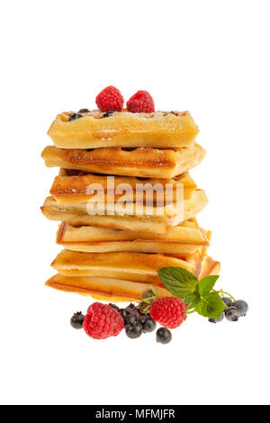 Stack of Belgian waffles with raspberries and blueberries islated on white background Stock Photo