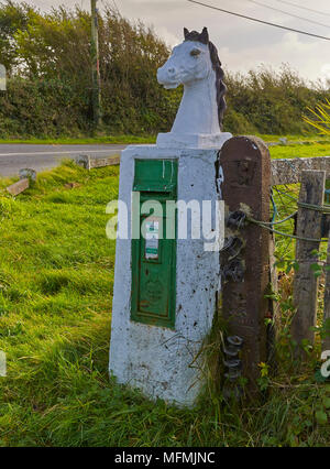 A Unique and quaint Post Box set within a cement carving of a Horses Head can be seen on the outskirts of Fethard Town, in County Wexford, Eire. Stock Photo