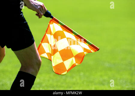 Detail of an assistant referee on the outline with shadow. Stock Photo