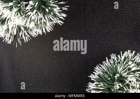 Christmas or New Year dark tissue background, Xmas black board framed with season decorations, space for a text, view from above Stock Photo