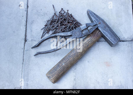 Old rusty tools must be replaced with new ones. Stock Photo