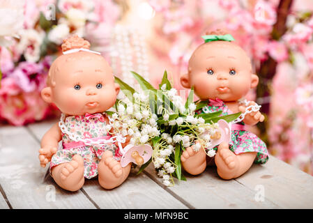 Beautiful girl, doll with flowers, floral wreath, bouquet, tied bows, butterly and sparkles. Stock Photo