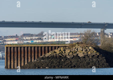 The NATO jetty and Cleddau bridge with the colourful houses of Neyland behind, Milford Haven Stock Photo