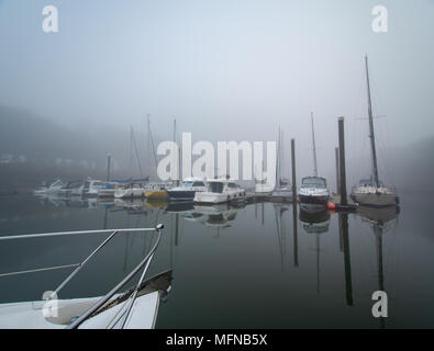 Perfect reflections on a  misty morning at Neyland Marina, Pembrokeshire Stock Photo
