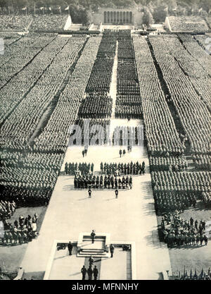 Staged Nuremberg Rally of Nazi Party members addressed by Hitler (foreground) Stock Photo