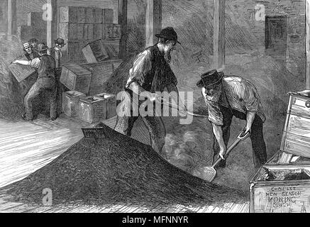 Tea warehouses of the East & West India Dock Company, London. Refilling tea chests after bulking (remixing after journey as smaller leaves & dust worked to bottom of chests in passage) Wood engraving, 1874. Stock Photo
